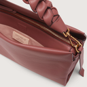 COCCINELLE handtas riem vlecht roze